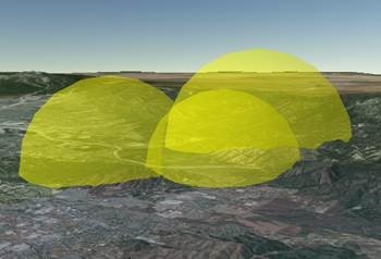 Three transparent yellow domes where only the fronts of the domes are visible